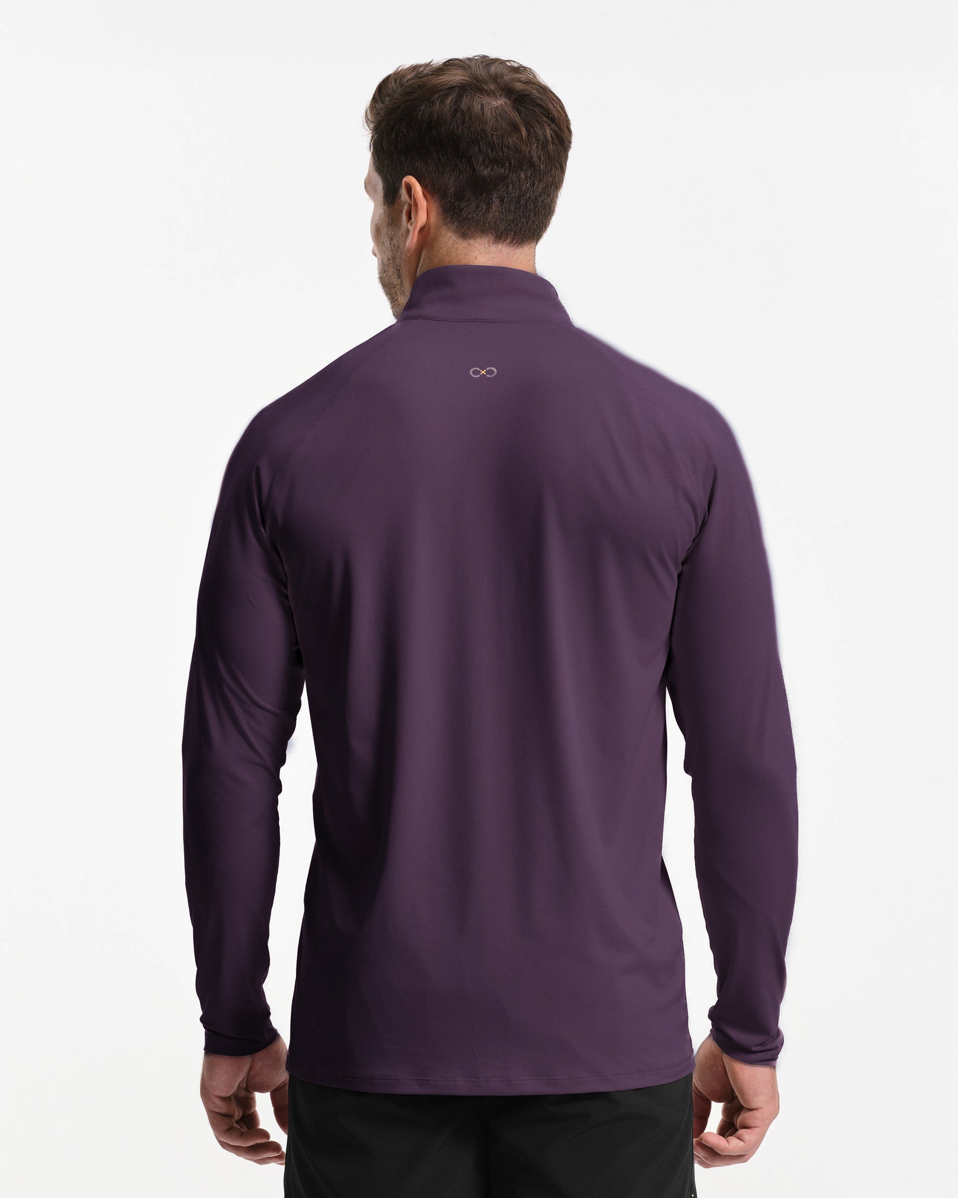 Man wearing a purple long-sleeve shirt on a white background